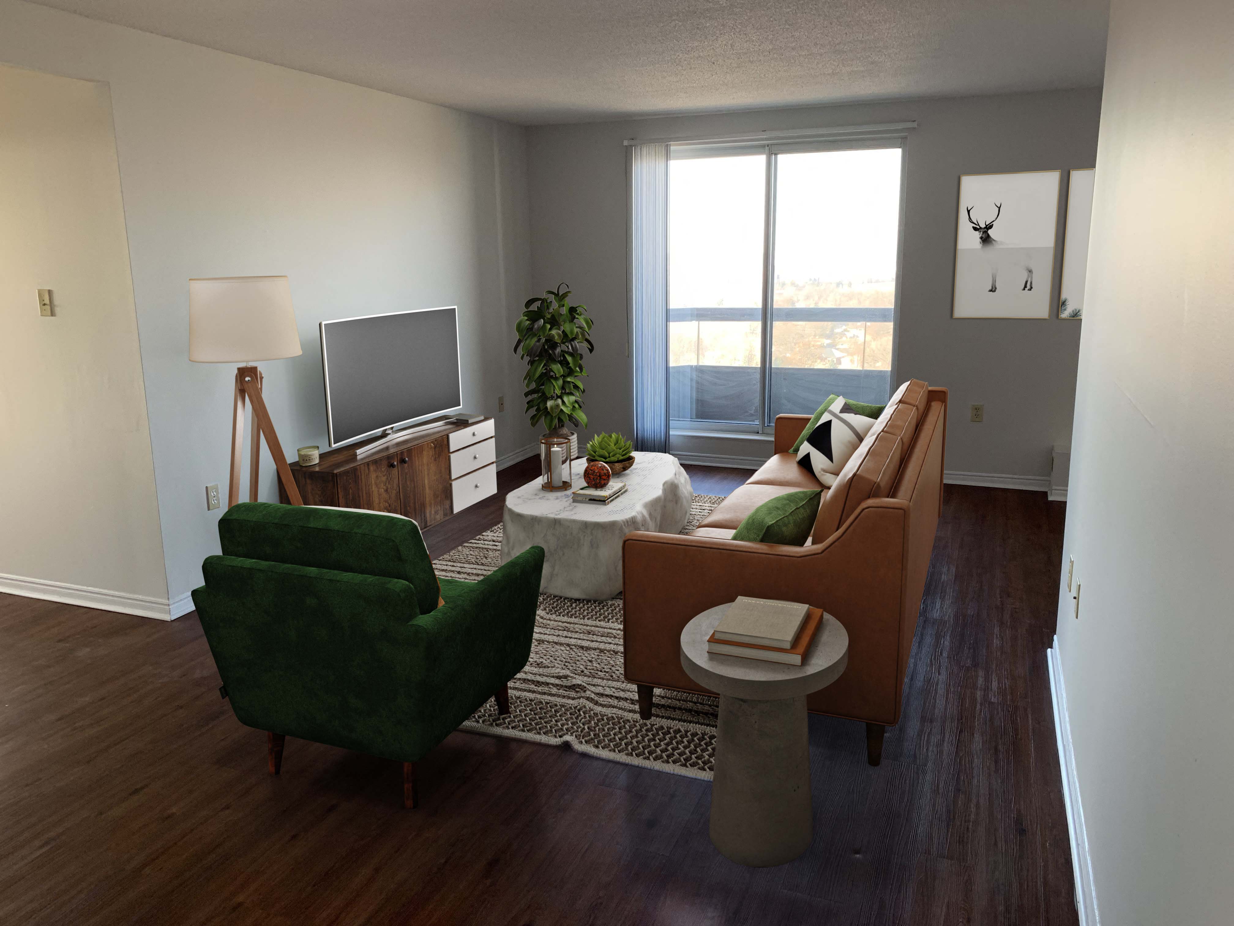 a living room with a couch and chairs and a tv